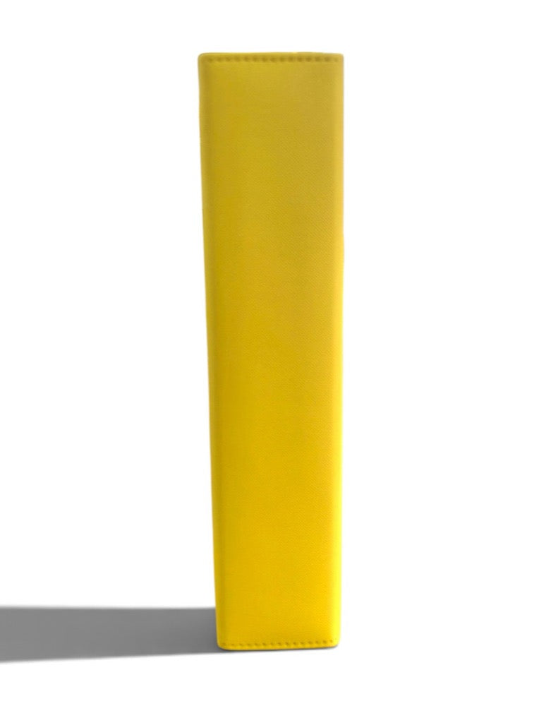 Side view of the Stay Flat binder standing on its edge, showing the squared rectangular spine